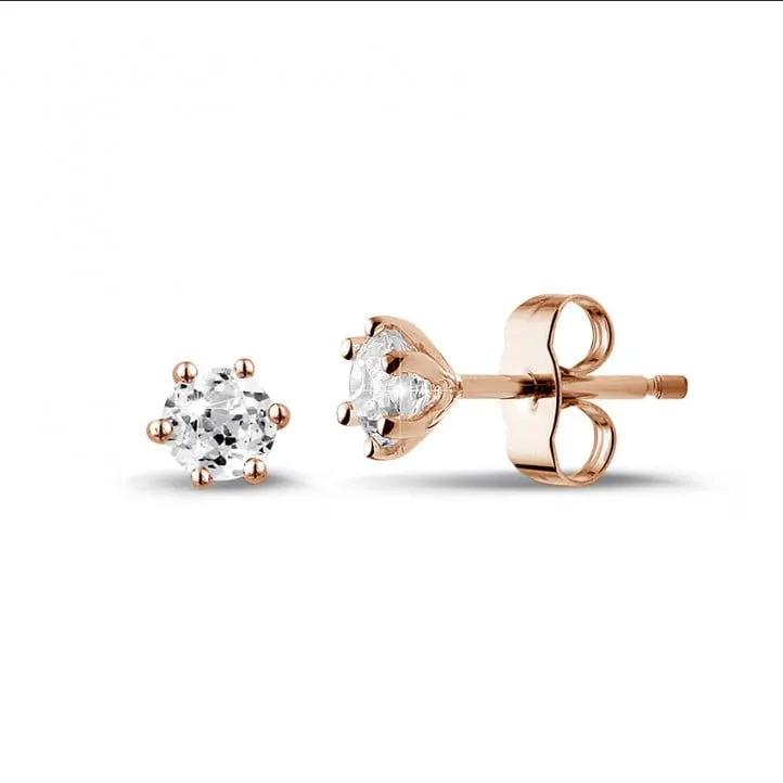 0.60 quilates pendientes diamantes clásicos en oro rojo con seis garras 